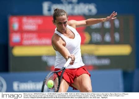 AUG 13, 2015: Roberta Vinci of Italy returns the ball to Daria Gavrilova of Russia during their Round 3 match of the Rogers Cup tournament at the Aviva Centre in Toronto, Ontario, Canada. TENNIS: AUG 13 Rogers Cup - Toronto Icon150813017241 EDITORIAL USE ONLY