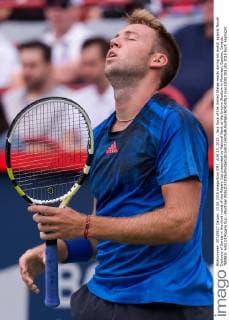 AUG 13, 2015 : Jack Sock of the United States reacts during his match against Novak Djokovic of Serbia in the third round of the Rogers Cup presented by National Bank at the Uniprix Stadium in Montreal, Quebec, Canada. TENNIS: AUG 13 Rogers Cup - Montreal Icon15081303 EDITORIAL USE ONLY