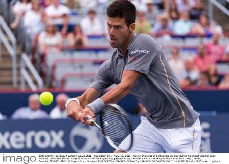 AUG 13, 2015 : Novak Djokovic of Serbia hits the ball during his match against Jack Sock of the United States in the third round of the Rogers Cup presented by National Bank at the Uniprix Stadium in Montreal, Quebec, Canada. TENNIS: AUG 13 Rogers Cup - Montreal Icon15081310 EDITORIAL USE ONLY