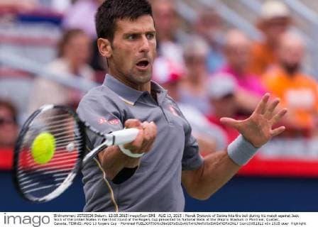 AUG 13, 2015 : Novak Djokovic of Serbia hits the ball during his match against Jack Sock of the United States in the third round of the Rogers Cup presented by National Bank at the Uniprix Stadium in Montreal, Quebec, Canada. TENNIS: AUG 13 Rogers Cup - Montreal Icon15081312 EDITORIAL USE ONLY