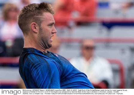 AUG 13, 2015 : Jack Sock of the United States reacts during his match against Novak Djokovic of Serbia in the third round of the Rogers Cup presented by National Bank at the Uniprix Stadium in Montreal, Quebec, Canada. TENNIS: AUG 13 Rogers Cup - Montreal Icon15081313 EDITORIAL USE ONLY