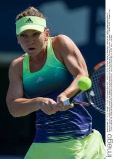 AUG 13, 2015: Simona Halep of Romania returns the ball to Angelique Kerber of Germany during their Round 3 match of the Rogers Cup tournament at the Aviva Centre in Toronto, Ontario, Canada. TENNIS: AUG 13 Rogers Cup - Toronto Icon150813030742 EDITORIAL USE ONLY
