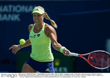 AUG 13, 2015: Angelique Kerber of Germany returns the ball to Simona Halep of Romania during their Round 3 match of the Rogers Cup tournament at the Aviva Centre in Toronto, Ontario, Canada. TENNIS: AUG 13 Rogers Cup - Toronto Icon150813032842 EDITORIAL USE ONLY