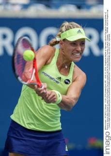 AUG 13, 2015: Angelique Kerber of Germany returns the ball to Simona Halep of Romania during their Round 3 match of the Rogers Cup tournament at the Aviva Centre in Toronto, Ontario, Canada. TENNIS: AUG 13 Rogers Cup - Toronto Icon150813038342 EDITORIAL USE ONLY