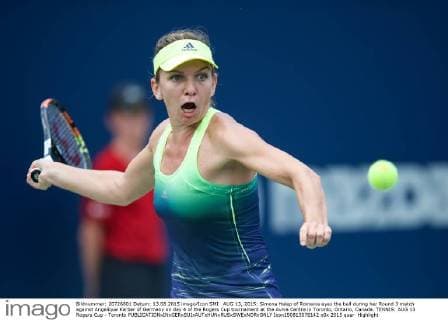 AUG 13, 2015: Simona Halep of Romania eyes the ball during her Round 3 match against Angelique Kerber of Germany on day 4 of the Rogers Cup tournament at the Aviva Centre in Toronto, Ontario, Canada. TENNIS: AUG 13 Rogers Cup - Toronto Icon150813078142 EDITORIAL USE ONLY