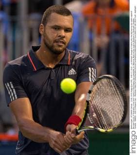 AUG 13, 2015 : Jo-Wilfried Tsonga of France hits the ball during his match against Bernard Tomic of Australia in the third round of the Rogers Cup presented by National Bank at the Uniprix Stadium in Montreal, Quebec, Canada. TENNIS: AUG 13 Rogers Cup - Montreal Icon15081372 EDITORIAL USE ONLY