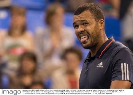 AUG 13, 2015 : Jo-Wilfried Tsonga of France reacts as he defeats Bernard Tomic of Australia in the third round of the Rogers Cup presented by National Bank at the Uniprix Stadium in Montreal, Quebec, Canada. TENNIS: AUG 13 Rogers Cup - Montreal Icon15081373 EDITORIAL USE ONLY