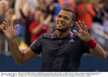 AUG 13, 2015 : Jo-Wilfried Tsonga of France reacts as he defeats Bernard Tomic of Australia in the third round of the Rogers Cup presented by National Bank at the Uniprix Stadium in Montreal, Quebec, Canada. TENNIS: AUG 13 Rogers Cup - Montreal Icon15081375 EDITORIAL USE ONLY