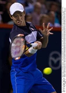 AUG 13, 2015 : Kei Nishikori of Japan hits the ball during his match against David Goffin of Belgium in the third round of the Rogers Cup presented by National Bank at the Uniprix Stadium in Montreal, Quebec, Canada. TENNIS: AUG 13 Rogers Cup - Montreal Icon15081385 EDITORIAL USE ONLY