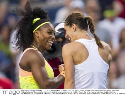 TORONTO, Aug. 13, 2015 -- Serena Williams (L) of the United States shakes hands with Andrea Petkovic of Germany after their third round women s singles match at the 2015 Rogers Cup in Toronto, Canada, Aug. 13, 2015. Serena Williams won 2-0. ) (SP)CANADA-TORONTO-TENNIS-ROGERS CUP-WOMEN S SINGLES ZouxZheng 