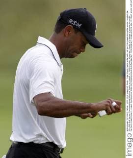Tiger Woods reacts as he walks off the 11th green during the second round of the 97th PGA Golf Herren Championship at Whistling Straits on August 14, 2015 in Kohler, Wisconsin. Woods is in danger of missing the cut for the third straight time in a major championship.  FPX2015081417 FRANKxPOLICH