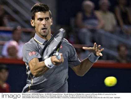 Novak Djokovic of Serbia hits a return to Ernests Gulbis of Latvia during the quarterfinal match at the Rogers Cup in Montreal, Canada, on Aug. 14, 2015. Djokovic won the match 2-1. ) (SP)CANADA-MONTREAL-ROGERS-CUP-QUARTERFINALS-DJOKOVIC AndrewxSoong 