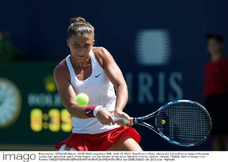 AUG 15, 2015: Sara Errani of Italy returns the ball to Simona Halep of Romania during their semi-final match of the Rogers Cup tournament at the Aviva Centre in Toronto, Ontario, Canada. TENNIS: AUG 15 Rogers Cup - Toronto Icon15081501131 EDITORIAL USE ONLY