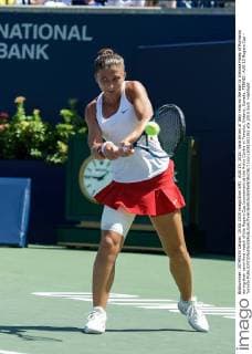 AUG 15, 2015: Sara Errani of Italy returns the ball to Simona Halep of Romania during their semi-final match of the Rogers Cup tournament at the Aviva Centre in Toronto, Ontario, Canada. TENNIS: AUG 15 Rogers Cup - Toronto Icon15081502351 EDITORIAL USE ONLY