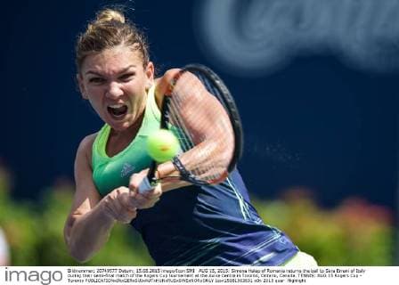 AUG 15, 2015: Simona Halep of Romania returns the ball to Sara Errani of Italy during their semi-final match of the Rogers Cup tournament at the Aviva Centre in Toronto, Ontario, Canada. TENNIS: AUG 15 Rogers Cup - Toronto Icon15081503631 EDITORIAL USE ONLY
