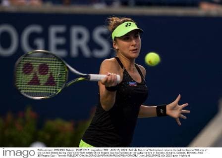 AUG 15, 2015: Belinda Bencic of Switzerland returns the ball to Serena Williams of the United States during their semi-final match of the Rogers Cup tournament at the Aviva Centre in Toronto, Ontario, Canada. TENNIS: AUG 15 Rogers Cup - Toronto Icon15081505462 EDITORIAL USE ONLY