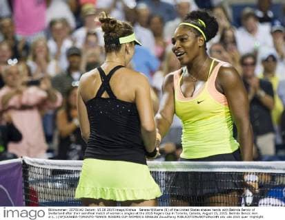 Serena Williams (R) of the United States shakes hands with Belinda Bencic of Switerland after their semifinal match of women s singles at the 2015 Rogers Cup in Toronto, Canada, August 15, 2015. Belinda Bencic won 2-1. ) (SP)CANADA-TORONTO-TENNIS-ROGERS CUP-WOMEN S SINGLES ZouxZheng 