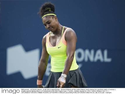 Serena Williams of the United States reacts during her semifinal match of women s singles against Belinda Bencic of Switerland at the 2015 Rogers Cup in Toronto, Canada, August 15, 2015. Serena Williams lost 1-2. ) (SP)CANADA-TORONTO-TENNIS-ROGERS CUP-WOMEN S SINGLES ZouxZheng 