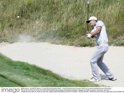 Dustin Johnson hits his sixth shot from a bunker behind the par-4 first hole during the final round of the 97th PGA Golf Herren Championship at Whistling Straits on August 16, 2015 in Kohler, Wisconsin. Johnson carded an four-over-par eight on the hole.  FPX2015081603 FRANKxPOLICH