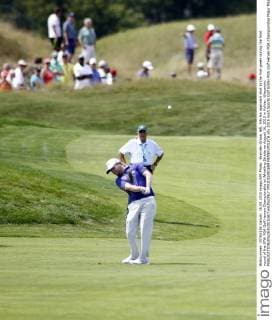 Branden Grace, left, hits his approach shot to the first green during the final round of the 97th PGA Golf Herren Championship at Whistling Straits on August 16, 2015 in Kohler, Wisconsin.  FPX2015081609 FRANKxPOLICH