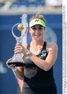 AUG 16, 2015: Belinda Bencic of Switzerland poses with the trophy after winning the Rogers Cup final match against Simona Halep of Romania at the Aviva Centre in Toronto, Ontario, Canada. TENNIS: AUG 16 Rogers Cup - Toronto Icon1508161303 EDITORIAL USE ONLY