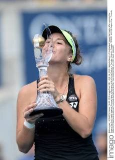 AUG 16, 2015: Belinda Bencic of Switzerland kisses the trophy after winning the Rogers Cup final match against Simona Halep of Romania at the Aviva Centre in Toronto, Ontario, Canada. TENNIS: AUG 16 Rogers Cup - Toronto Icon1508161398 EDITORIAL USE ONLY
