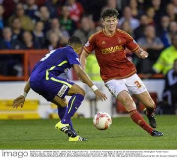 18.08.2015. Nottingham, England. Skybet Championship. Nottingham Forest versus Charlton Athletic. Oliver Burke of Nottingham Forest moves the ball around Ahmed Kashi of Charlton. xAndyxThompsonx  ActionPlus11650793