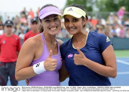 Aug. 19, 2015 - Mason, Ohio, United States - MARTINA HINGIS (left) and SANIA MIRZA pose for a picture following their win in their doubles match v. J. Goerges and K. Jans-Ignacik at the Western & Southern Open in Mason Ohio on Wednesday 19 August 2015 Tennis 2015 -Western & Southern Open - Day 3 - ZUMAl132