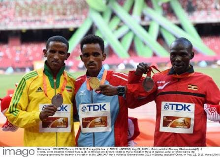 (150822) --BEIJING, Aug 22, 2015 -- Gold medallist Ghirmay Ghebreslassie(C) of Eritrea, silver medallist Yemane Tsegay (L) of Ethiopia and bronze medallist Munyo Solomon Mutai of Uganda, pose for photo during the awarding ceremony for the men s marathon at the 15th IAAF World Athletics Championships 2015 in Beijing, capital of China, on Aug. 22, 2015. Wang Lili)) (SP)CHINA-BEIJING-IAAF WORLD CHAMPIONSHIPS-MEN S MARATHON (CN) YuexYuewei 