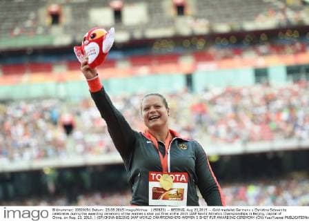 (150823) -- BEIJING, Aug 23,2015 -- Gold medalist Germany s Christina Schwanitz celebrates during the awarding ceremony of the women s shot put final at the 2015 IAAF World Athletics Championships in Beijing, capital of China, on Aug. 23, 2015. ) (SP)CHINA-BEIJING-IAAF WORLD CHAMPIONSHIPS-WOMEN S SHOT PUT AWARDING CEREMONY (CN) YuexYuewei 