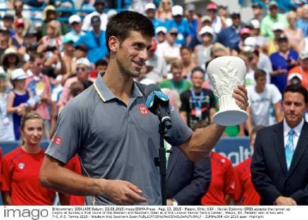 Aug. 23, 2015 - Mason, Ohio, USA - Novak Djokovic (SRB) accepts the runner-up trophy at Sunday s final round of the Western and Southern Open at at the Lindner Family Tennis Center , Mason, Oh. Federer won in two sets 7-6, 6-3. Tennis 2015 - Western And Southern Open - ZUMAs304