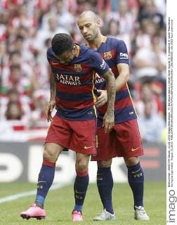 FC Barcelona Barca s Daniel Alves injured (l) in presence of Javier Mascherano during La Liga match. August 23,2015.  (2015082336)