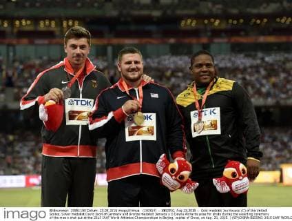 (150824) -- BEIJING, Aug 23,2015 -- Gold medalist Joe Kovacs (C) of the United States, Silver medalist David Storl of Germany and Bronze medalist Jamaica s O Dayne Richards pose for photo during the awarding ceremony of the men s shot put at the 2015 IAAF World Athletics Championships in Beijing, capital of China, on Aug. 23, 2015. ) (SP)CHINA-BEIJING-2015 IAAF WORLD CHAMPIONSHIPS-MEN S SHOT PUT AWARDING CEREMONY (CN) GongxLei 