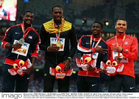 BEIJING, CHINA. AUGUST 24, 2015. Silver medalist, US Justin Gatlin, Gold medalist, Jamaica s Usain Bolt, Bronze medalists, US Trayvon Bromell and Canada s Andre De Grasse (L-R) at an awards ceremony for the men s 100m final at the 15th IAAF World Championships in Athletics at Beijing National Stadium. Vladimir Smirnov TASS  TS00B306