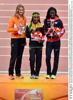 (150825) -- BEIJING, Aug. 25, 2015 -- Gold medalist Jamaica s Shelly-Ann Fraser-Pryce (C), silver medalist the Netherlands Dafne Schippers (L) and bronze medalist Tori Bowie of the United States celebrate during the awarding ceremony of the women s 100m event at the 2015 IAAF World Championships at the Bird s Nest National Stadium in Beijing, capital of China, Aug. 25, 2015. ) (SP)CHINA-BEIJING-IAAF WORLD CHAMPIONSHIPS-WOMEN S 100M AWARDING CEREMONY (CN) LixWen 