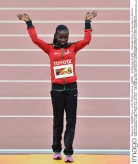(150825) -- BEIJING, Aug. 25, 2015 -- Gold medalist Kenya s Vivian Jepkemoi Cheruiyot celebrates during the awarding ceremony of the women s 10000m event at the 2015 IAAF World Championships at the Bird s Nest National Stadium in Beijing, capital of China, Aug. 25, 2015. ) (SP)CHINA-BEIJING-IAAF WORLD CHAMPIONSHIPS-WOMEN S 10000M AWARDING CEREMONY (CN) LixWen 
