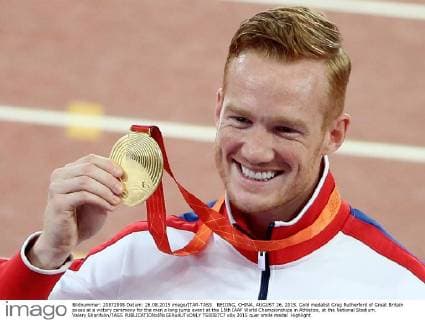 BEIJING, CHINA. AUGUST 26, 2015. Gold medalist Greg Rutherford of Great Britain poses at a victory ceremony for the men s long jump event at the 15th IAAF World Championships in Athletics, at the National Stadium. Valery Sharifulin TASS  TS00B7C7