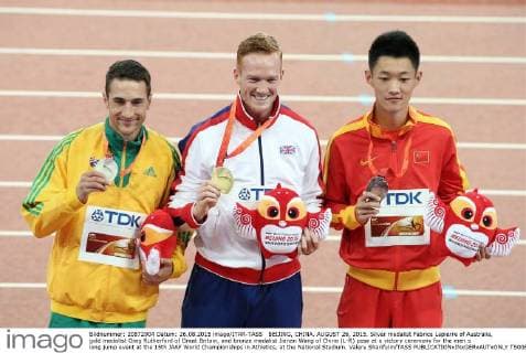 BEIJING, CHINA. AUGUST 26, 2015. Silver medalist Fabrice Lapierre of Australia, gold medalist Greg Rutherford of Great Britain, and bronze medalist Jianan Wang of China (L-R) pose at a victory ceremony for the men s long jump event at the 15th IAAF World Championships in Athletics, at the National Stadium. Valery Sharifulin TASS  TS00B7C5