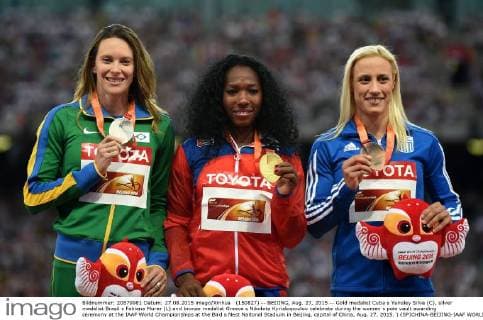 (150827) -- BEIJING, Aug. 27, 2015 -- Gold medalist Cuba s Yarisley Silva (C), silver medalist Brazil s Fabiana Murer (L) and bronze medalist Greece s Nikoleta Kyriakopoulou celebrate during the women s pole vault awarding ceremony at the IAAF World Championships at the Bird s Nest Naitonal Stadium in Beijing, capital of China, Aug. 27, 2015. ) (SP)CHINA-BEIJING-IAAF WORLD CHAMPIONSHIPS-WOMEN S POLE VAULT AWARDING CEREMONY (CN) LixWen 
