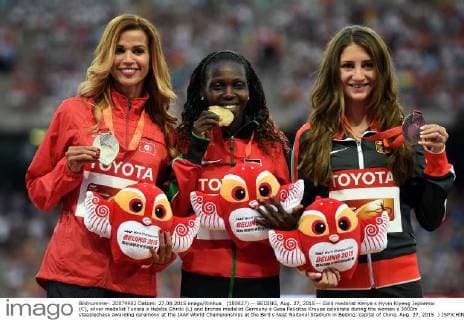 (150827) -- BEIJING, Aug. 27, 2015 -- Gold medalist Kenya s Hyvin Kiyeng Jepkemoi (C), silver medalist Tunisia s Habiba Ghribi (L) and bronze medalist Germany s Gesa Felicitas Krause celebrate during the women s 3000m steeplechase awarding ceremony at the IAAF World Championships at the Bird s Nest Naitonal Stadium in Beijing, capital of China, Aug. 27, 2015. ) (SP)CHINA-BEIJING-IAAF WORLD CHAMPIONSHIPS-WOMEN S 3000M STEEPLECHASE AWARDING CEREMONY (CN) LixWen 