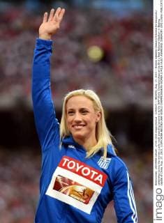 (150827) -- BEIJING, Aug. 27, 2015 -- Bronze medalist Greece s Nikoleta Kyriakopoulou celebrates during the women s pole vault awarding ceremony at the IAAF World Championships at the Bird s Nest Naitonal Stadium in Beijing, capital of China, Aug. 27, 2015. ) (SP)CHINA-BEIJING-IAAF WORLD CHAMPIONSHIPS-WOMEN S POLE VAULT AWARDING CEREMONY (CN) LixWen 