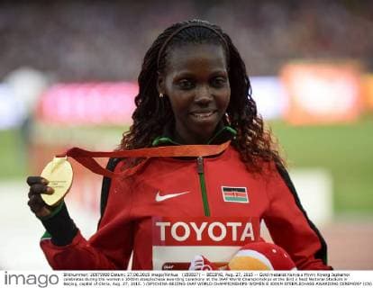(150827) -- BEIJING, Aug. 27, 2015 -- Gold medalist Kenya s Hyvin Kiyeng Jepkemoi celebrates during the women s 3000m steeplechase awarding ceremony at the IAAF World Championships at the Bird s Nest Naitonal Stadium in Beijing, capital of China, Aug. 27, 2015. ) (SP)CHINA-BEIJING-IAAF WORLD CHAMPIONSHIPS-WOMEN S 3000M STEEPLECHASE AWARDING CEREMONY (CN) LixWen 