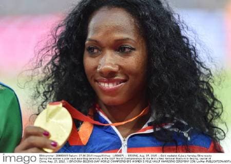 (150827) -- BEIJING, Aug. 27, 2015 -- Gold medalist Cuba s Yarisley Silva reacts during the women s pole vault awarding ceremony at the IAAF World Championships at the Bird s Nest Naitonal Stadium in Beijing, capital of China, Aug. 27, 2015. ) (SP)CHINA-BEIJING-IAAF WORLD CHAMPIONSHIPS-WOMEN S POLE VAULT AWARDING CEREMONY (CN) LixWen 