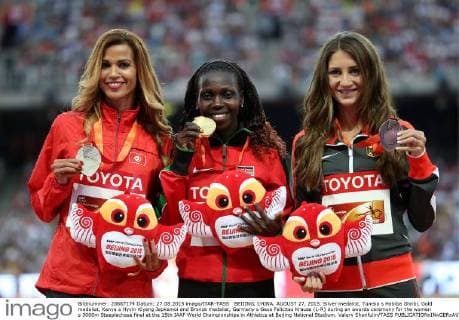 BEIJING, CHINA. AUGUST 27, 2015. Silver medalist, Tunisia s Habiba Ghribi, Gold medalist, Kenya s Hyvin Kiyeng Jepkemoi and Bronze medalist, Germany s Gesa Felicitas Krause (L-R) during an awards ceremony for the women s 3000m Steeplechase final at the 15th IAAF World Championships in Athletics at Beijing National Stadium. Valery Sharifulin TASS  TS00BA8C