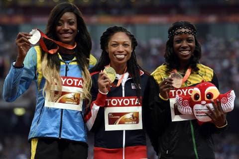 (150828) -- BEIJING, Aug. 28, 2015 -- Gold medalist Allyson Felix (C) of the United States, silver medalist Bahamas Shaunae Miller (L) and bronze medalist Jamaica s Shericka Jackson celebrate during the women s 400m awarding ceremony at the 2015 IAAF World Championships at Bird s Nest National Stadium in Bejing, capital of China, Aug. 28, 2015. ) (SP)CHINA-BEIJING-IAAF WORLD CHAMPIONSHIPS-WOMEN S 400M AWARDING CEREMONY (CN) GongxLei 