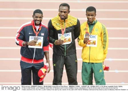BEIJING, CHINA - AUGUST 28: (CHINA OUT) (L-R) Silver medalist Justin Gatlin of the United States, gold medalist Usain Bolt of Jamaica and bronze medalist Anaso Jobodwana of South Africa pose on the podium during the medal ceremony for the Men s 200 metres final during day seven of the 15th IAAF World Athletics Championships Beijing 2015 at Beijing National Stadium on August 28, 2015 in Beijing, China.  CFP471986691 