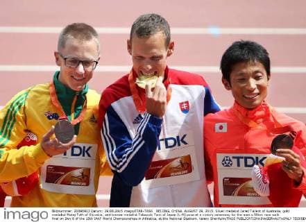 BEIJING, CHINA. AUGUST 29, 2015. Silver medalist Jared Tallent of Australia, gold medalist Matej Toth of Slovakia, and bronze medalist Takayuki Tanii of Japan (L-R) pose at a victory ceremony for the men s 50km race walk final on Day 8 of the 15th IAAF World Championships in Athletics, at the National Stadium. Valery Sharifulin TASS  TS00BD0B