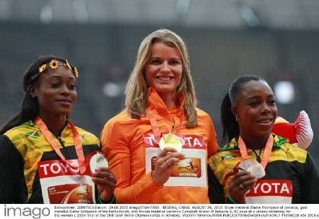 BEIJING, CHINA. AUGUST 29, 2015. Silver medalist Elaine Thompson of Jamaica, gold medalist Dafne Schippers of the Netherlands, and bronze medalist Veronica Campbell-Brown of Jamaica (L-R) pose at a victory ceremony for the women s 200m final at the 15th IAAF World Championships in Athletics. Vladimir Smirnov TASS  TS00BD28