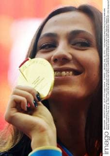(150830) -- BEIJING, Aug. 30, 2015 -- Gold medalist Russia s Maria Kuchina celebrates during the awarding ceremony of the women s high jump event at the 2015 IAAF World Champships at the Bird s Nest National Stadium in Beijing, capital of China, Aug. 30, 2015. ) (SP)CHINA-BEIJING-IAAF WORLD CHAMPIONSHIPS-WOMEN S HIGH JUMP AWARDING CEREMONY (CN) WangxHaofei 