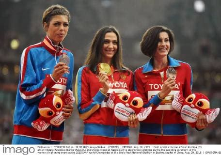 (150830) -- BEIJING, Aug. 30, 2015 -- Gold medalist Russia s Maria Kuchina (C), silver medalist Croatia s Blanka Vlasic (L) and bronze medalist Russia s Anna Chicherova celebrate during the awarding ceremony of the women s high jump event at the 2015 IAAF World Champships at the Bird s Nest National Stadium in Beijing, capital of China, Aug. 30, 2015. ) (SP)CHINA-BEIJING-IAAF WORLD CHAMPIONSHIPS-WOMEN S HIGH JUMP AWARDING CEREMONY (CN) WangxHaofei 